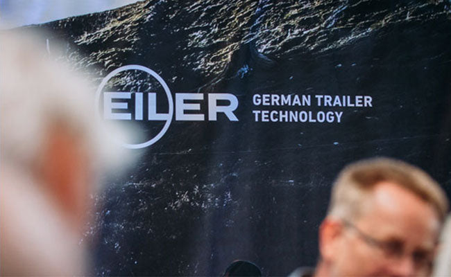 TREILER logo against a background